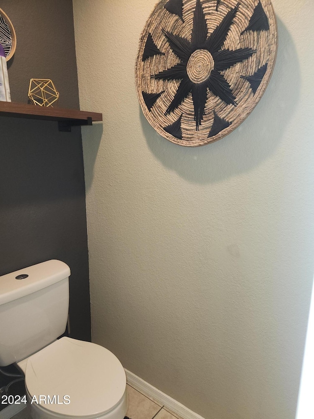 bathroom featuring tile patterned flooring and toilet