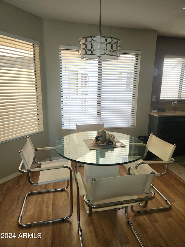 dining space featuring wood-type flooring