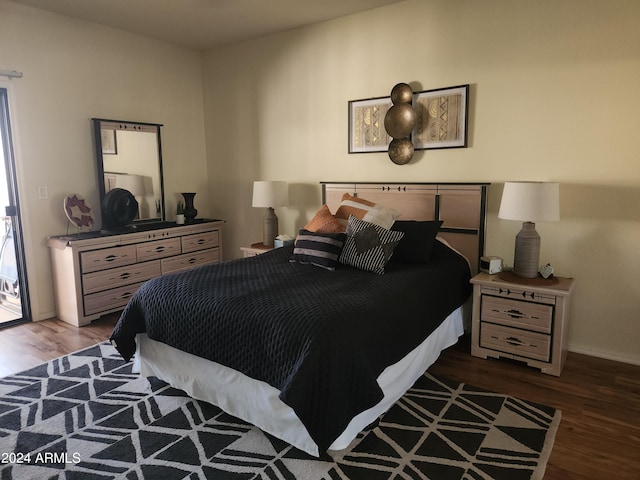 bedroom featuring dark hardwood / wood-style flooring