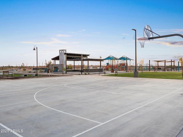 view of sport court featuring playground community and community basketball court