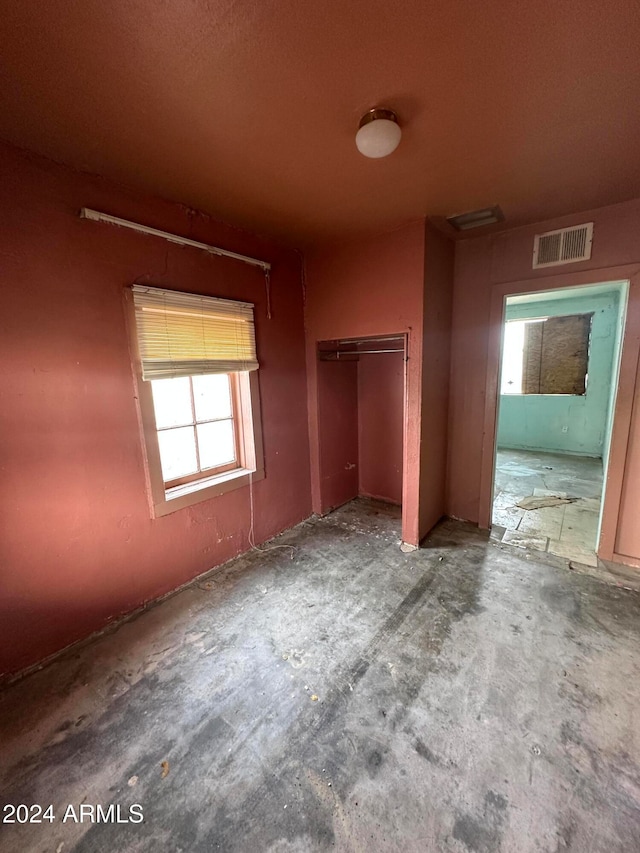 unfurnished bedroom with a closet