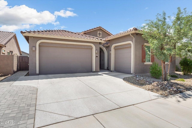 mediterranean / spanish-style house featuring a garage