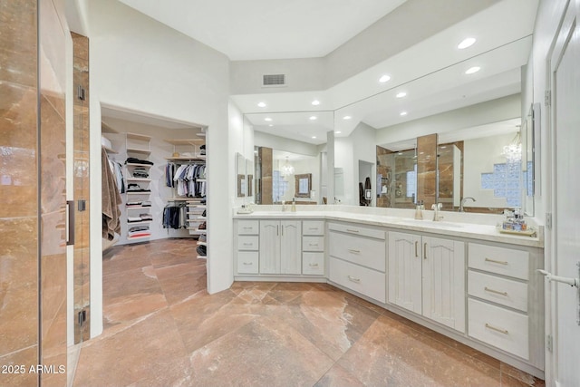 bathroom featuring vanity and walk in shower