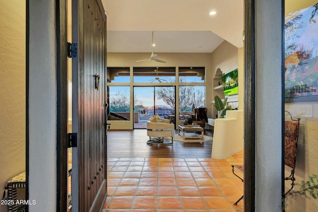 hall featuring light tile patterned floors