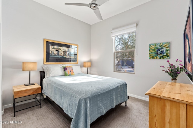 bedroom featuring ceiling fan and dark colored carpet