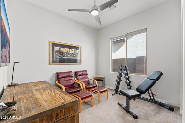 exercise room with carpet and ceiling fan