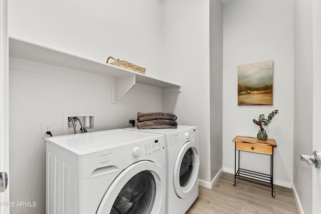 laundry area featuring washing machine and clothes dryer