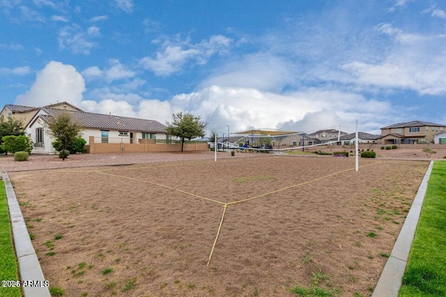 view of home's community featuring volleyball court