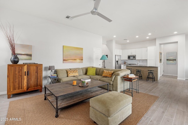 living room featuring ceiling fan