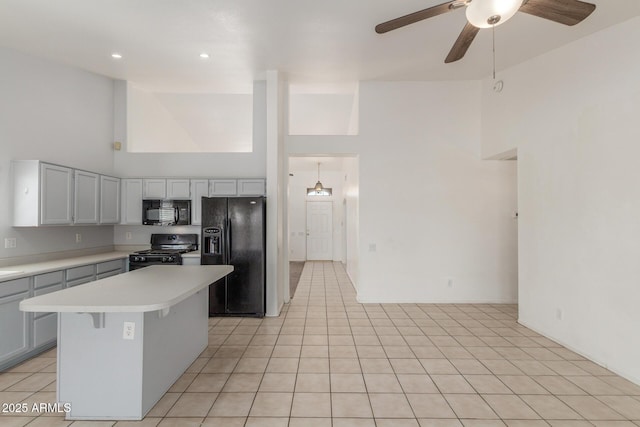 1371 W Gary Dr, Chandler, AZ 85224 - kitchen featuring black appliances, high vaulted ceiling, light countertops, ceiling fan, and a kitchen island