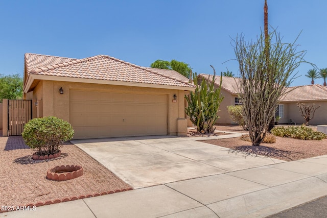 1371 W Gary Dr, Chandler, AZ 85224 - view of front of property with a tile roof, stucco siding, driveway, a gate, and an attached garage