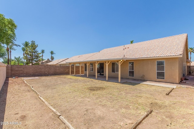 1371 W Gary Dr, Chandler, AZ 85224 - rear view of property featuring a fenced backyard, stucco siding, a tiled roof, and a patio