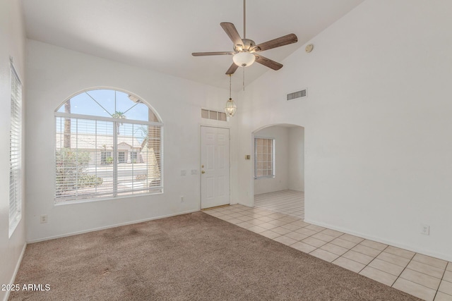 1371 W Gary Dr, Chandler, AZ 85224 - spare room with ceiling fan, arched walkways, light carpet, light tile patterned floors, and high vaulted ceiling