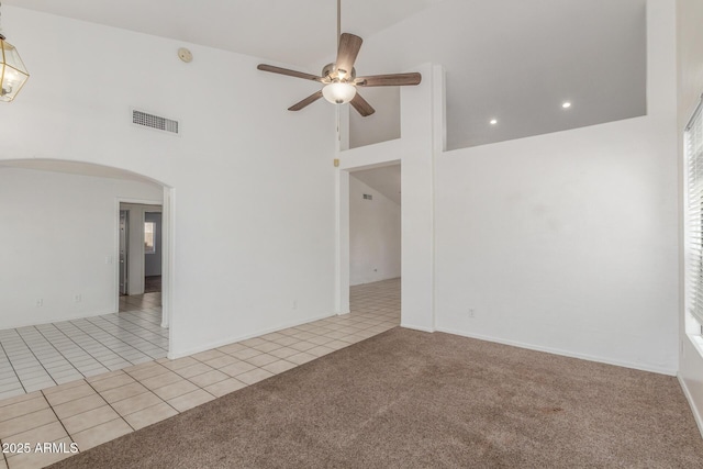 1371 W Gary Dr, Chandler, AZ 85224 - carpeted spare room with a high ceiling, ceiling fan, arched walkways, and tile patterned floors