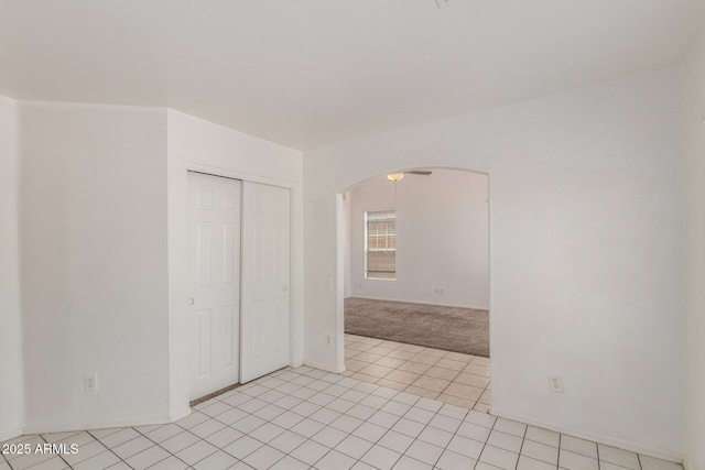 1371 W Gary Dr, Chandler, AZ 85224 - spare room featuring arched walkways, light carpet, and light tile patterned floors