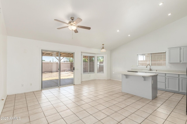 1371 W Gary Dr, Chandler, AZ 85224 - kitchen with light countertops, ceiling fan, high vaulted ceiling, a kitchen bar, and recessed lighting