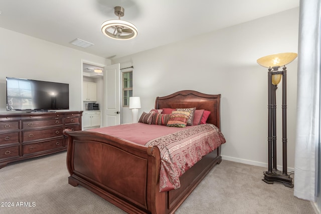 bedroom with light colored carpet