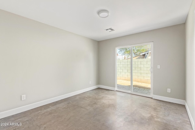 empty room with concrete flooring