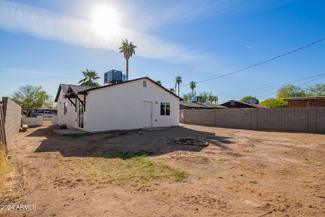 back of property featuring central air condition unit