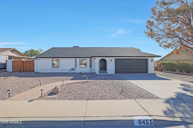 ranch-style home featuring a garage