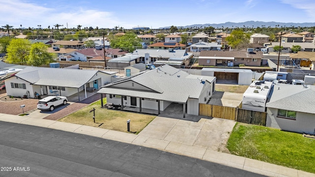 drone / aerial view featuring a mountain view and a residential view