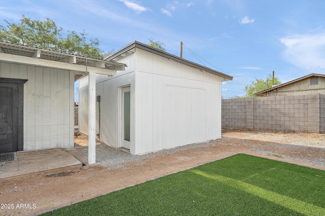 view of shed with fence