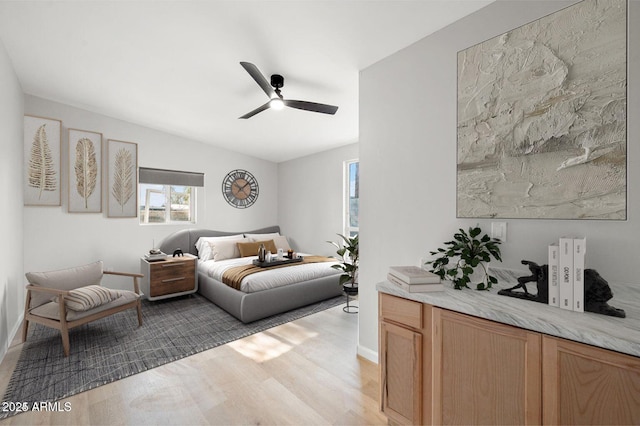 bedroom featuring ceiling fan and light wood-type flooring