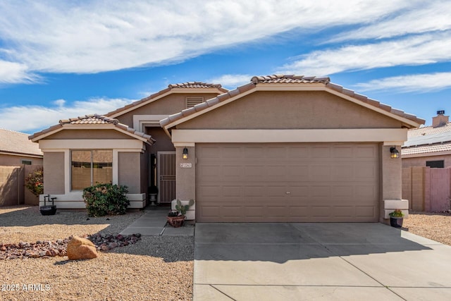 single story home with a garage, driveway, fence, and stucco siding