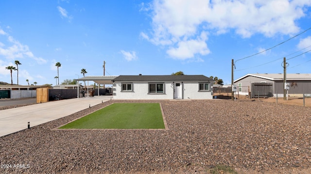 back of property with a carport