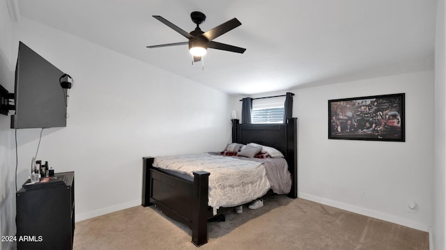 bedroom featuring light carpet and ceiling fan