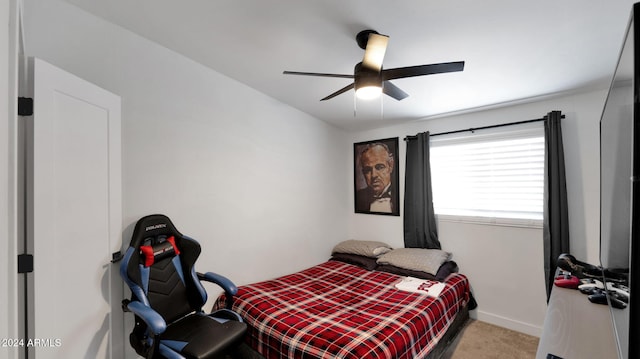 bedroom with ceiling fan and light colored carpet