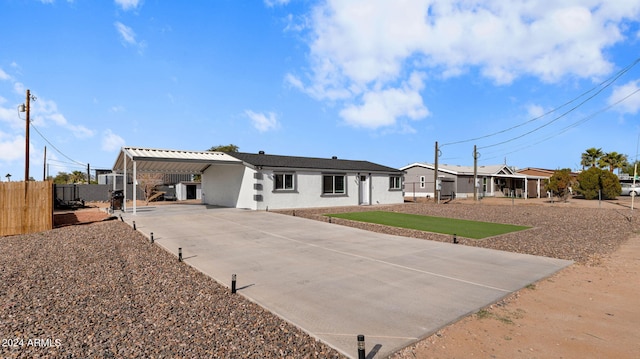 view of front facade with a carport