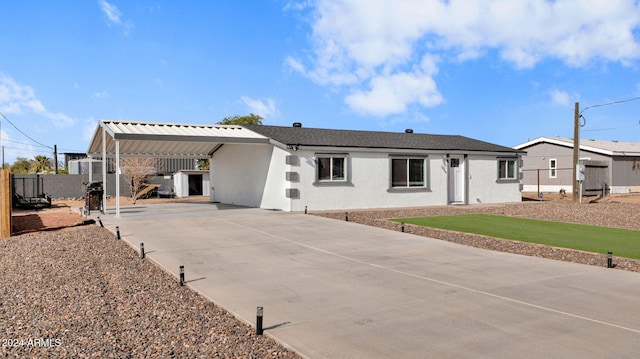 back of property featuring a carport