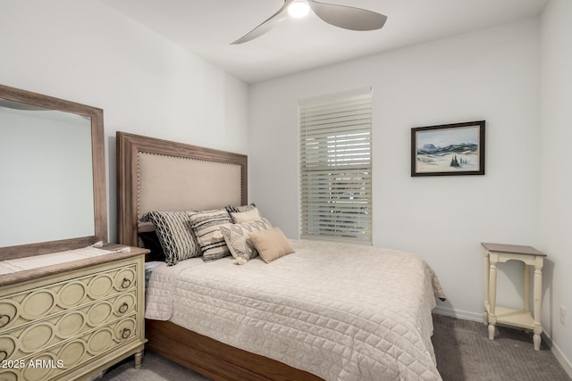 bedroom featuring ceiling fan and baseboards