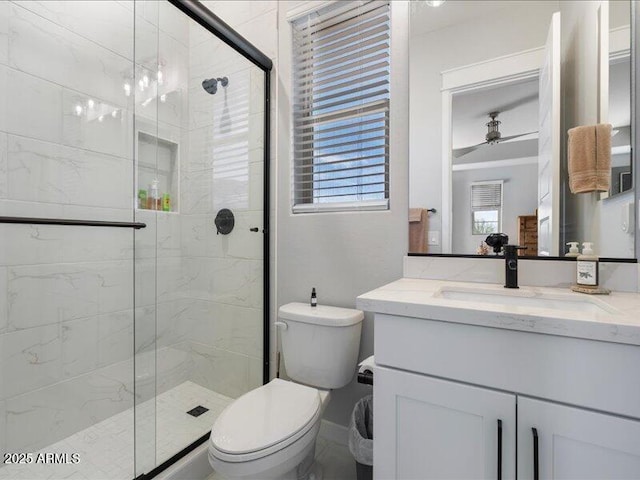 bathroom with walk in shower, vanity, and toilet