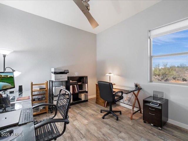 office area with light hardwood / wood-style floors