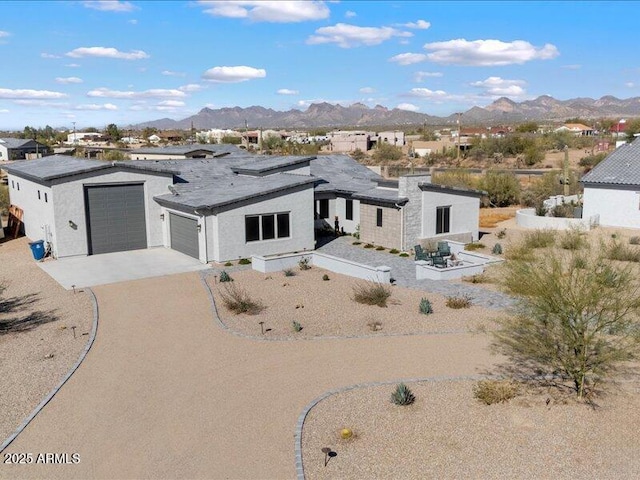 view of front of house with a mountain view and a garage