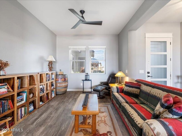 living area with hardwood / wood-style flooring and ceiling fan