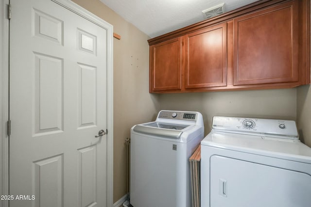 18841 E Pelican Ct, Queen Creek, AZ 85142 - washroom featuring visible vents, cabinet space, and separate washer and dryer
