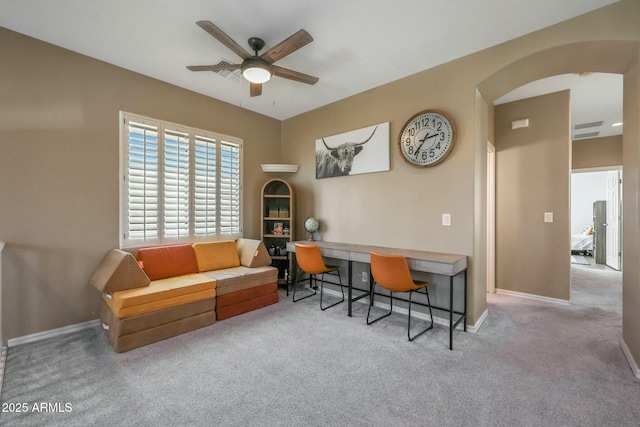 18841 E Pelican Ct, Queen Creek, AZ 85142 - carpeted home office featuring baseboards, arched walkways, and ceiling fan