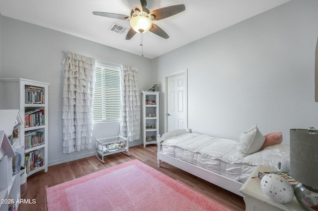18841 E Pelican Ct, Queen Creek, AZ 85142 - bedroom with ceiling fan, visible vents, and wood finished floors
