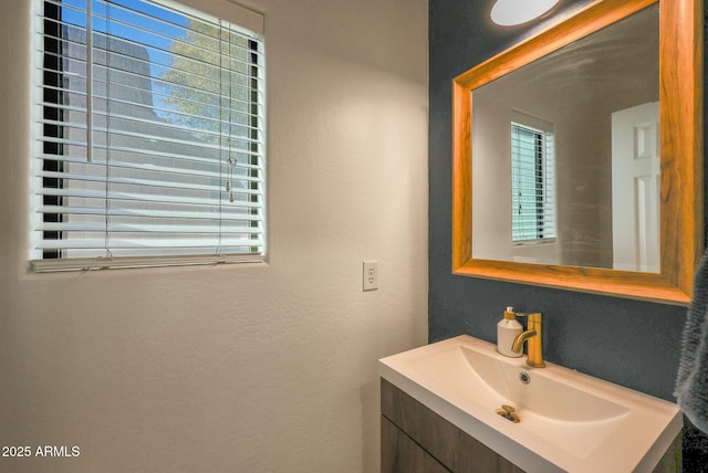 18841 E Pelican Ct, Queen Creek, AZ 85142 - bathroom with vanity and a textured wall