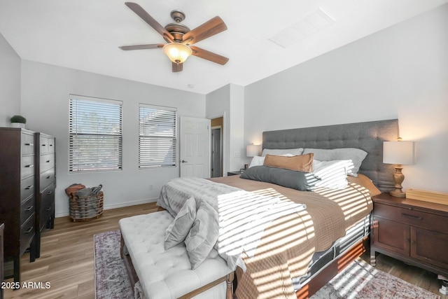 18841 E Pelican Ct, Queen Creek, AZ 85142 - bedroom featuring baseboards, light wood-style flooring, and a ceiling fan