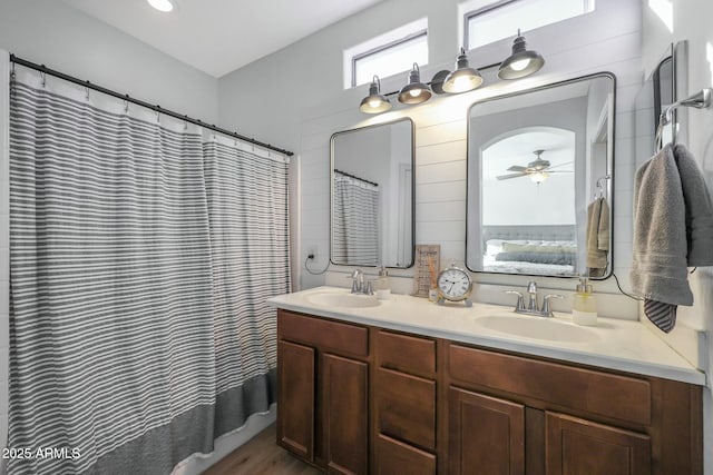 18841 E Pelican Ct, Queen Creek, AZ 85142 - bathroom with double vanity, connected bathroom, a shower with shower curtain, and a sink