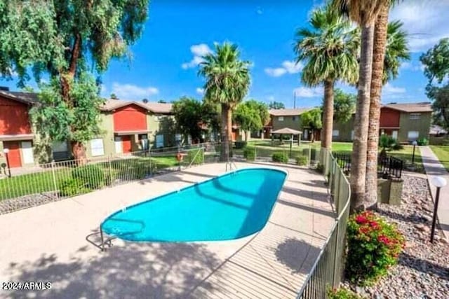 view of swimming pool featuring a patio area