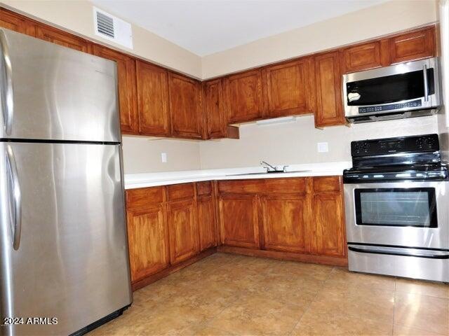 kitchen with stainless steel appliances and sink