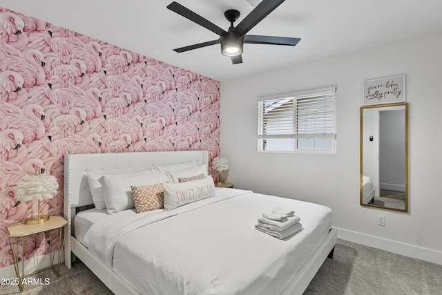 bedroom with ceiling fan, baseboards, and carpet flooring
