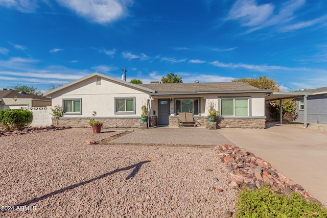 ranch-style home with a patio area