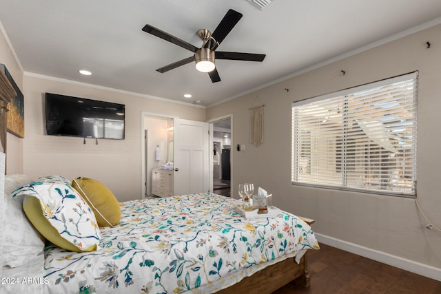 bedroom featuring ceiling fan, ensuite bath, and crown molding