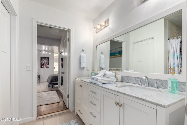 bathroom with hardwood / wood-style floors and vanity